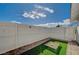 Small fenced patio with artificial turf and pet game at 2690 S Dandelion St, Pahrump, NV 89048