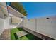 Small fenced patio with artificial turf and pet game at 2690 S Dandelion St, Pahrump, NV 89048