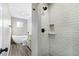 Modern bathroom with a subway tiled shower stall and a standalone soaking tub at 3008 Colanthe Ave, Las Vegas, NV 89102