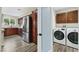 Convenient laundry area adjacent to the kitchen, featuring updated appliances and matching cabinetry at 3008 Colanthe Ave, Las Vegas, NV 89102