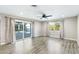 Bright living room featuring modern flooring, neutral paint, and a sliding glass door to the backyard at 3008 Colanthe Ave, Las Vegas, NV 89102