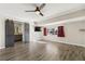 Spacious main bedroom with an ensuite bathroom, vinyl flooring and ceiling fan at 3008 Colanthe Ave, Las Vegas, NV 89102