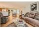 Open living space with hardwood floors and a view into dining area at 3055 Key Largo Dr # 203, Las Vegas, NV 89120
