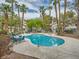 Community pool with surrounding patio furniture at 3055 Key Largo Dr # 203, Las Vegas, NV 89120