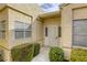 Front entry with sunburst door and neatly trimmed shrubs at 448 Wonderstone Dr, Las Vegas, NV 89107