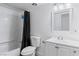 Clean bathroom with white vanity and bathtub shower combo at 4554 S Nellis Blvd, Las Vegas, NV 89121