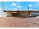 Ranch style home with carport and gravel landscaping at 4554 S Nellis Blvd, Las Vegas, NV 89121