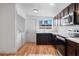 Modern kitchen featuring dark wood cabinets and stainless steel appliances at 4554 S Nellis Blvd, Las Vegas, NV 89121