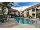 Inviting community pool with patio furniture and building views at 460 Elm Dr # 106, Las Vegas, NV 89169