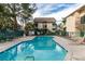 Community pool with surrounding patio and building views at 460 Elm Dr # 106, Las Vegas, NV 89169