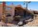 Spacious backyard oasis with putting green, water feature, and patio seating at 479 Via Ventana Dr, Mesquite, NV 89027