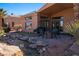 Relaxing backyard with putting green, water feature and patio at 479 Via Ventana Dr, Mesquite, NV 89027