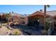 Outdoor entertaining area with putting green and covered patio at 479 Via Ventana Dr, Mesquite, NV 89027