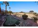 Landscaped backyard oasis with putting green and water feature at 479 Via Ventana Dr, Mesquite, NV 89027