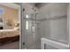 Large walk-in shower with pebble flooring and glass enclosure at 479 Via Ventana Dr, Mesquite, NV 89027