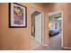 Hallway with artwork and access to bedroom and bathroom at 479 Via Ventana Dr, Mesquite, NV 89027