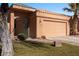 Front view of a tan house with a single car garage at 479 Via Ventana Dr, Mesquite, NV 89027