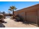 Side of house with walkway, garage, and AC unit at 479 Via Ventana Dr, Mesquite, NV 89027
