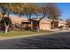 Street view of several similar homes with mature trees at 479 Via Ventana Dr, Mesquite, NV 89027