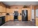 Open kitchen boasts granite counters, stainless steel appliances, and light wood cabinets at 479 Via Ventana Dr, Mesquite, NV 89027