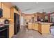 Eat-in kitchen has granite counters, stainless steel appliances, and light wood cabinets at 479 Via Ventana Dr, Mesquite, NV 89027
