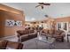 Open concept living room with leather furniture, high ceilings and kitchen view at 479 Via Ventana Dr, Mesquite, NV 89027