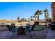 Enjoy this backyard patio with fire pit and putting green at 479 Via Ventana Dr, Mesquite, NV 89027