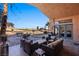 Outdoor patio with seating area, grill, putting green, and golf course view at 479 Via Ventana Dr, Mesquite, NV 89027