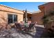 Outdoor patio with seating area, umbrella, and tile flooring at 479 Via Ventana Dr, Mesquite, NV 89027