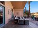 Spacious patio with seating area, fire pit, and putting green at 479 Via Ventana Dr, Mesquite, NV 89027