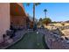 Relaxing patio with putting green and seating area, perfect for outdoor entertaining at 479 Via Ventana Dr, Mesquite, NV 89027