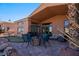 Backyard patio with fire pit, putting green, and water feature at 479 Via Ventana Dr, Mesquite, NV 89027