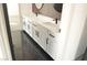 Elegant bathroom with double vanity, black matte hardware, and marble-look tile at 4871 Charlemagne Ave, Las Vegas, NV 89130