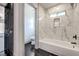 Bathroom features marble shower, black fixtures, and a stylish bathtub at 4871 Charlemagne Ave, Las Vegas, NV 89130
