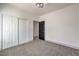 Simple bedroom with a double closet and doorway to another room at 4871 Charlemagne Ave, Las Vegas, NV 89130