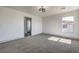 Bedroom with modern light, neutral carpet, and an ensuite bathroom at 4871 Charlemagne Ave, Las Vegas, NV 89130