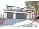 Two-story house with three-car garage and landscaped yard at 4871 Charlemagne Ave, Las Vegas, NV 89130