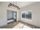 Cozy living space featuring stylish lighting fixture and view into an adjacent room through an open doorway at 4871 Charlemagne Ave, Las Vegas, NV 89130