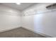 Simple walk-in closet has carpet and wire shelving for optimal organization at 4871 Charlemagne Ave, Las Vegas, NV 89130