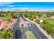 Gated community entrance with mountain views and landscaping at 5105 Kingsbridge Dr, Las Vegas, NV 89130