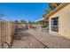 Relaxing backyard with covered patio, gravel landscaping, and sitting area at 5105 Kingsbridge Dr, Las Vegas, NV 89130