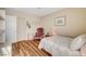 Charming bedroom with a comfortable bed and chair at 5105 Kingsbridge Dr, Las Vegas, NV 89130