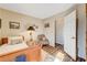 Cozy bedroom with wood flooring and a charming sitting area at 5105 Kingsbridge Dr, Las Vegas, NV 89130