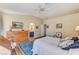 A bright bedroom features wood floors, decor, and an ensuite bathroom at 5105 Kingsbridge Dr, Las Vegas, NV 89130