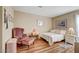 Cozy bedroom with wood floors and seating at 5105 Kingsbridge Dr, Las Vegas, NV 89130