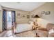 Bright bedroom with wood flooring and seating area at 5105 Kingsbridge Dr, Las Vegas, NV 89130