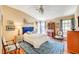 A bright bedroom features wood floors, beautiful decor, and lots of light at 5105 Kingsbridge Dr, Las Vegas, NV 89130