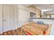 Bright dining area with wood table and chairs, adjacent to kitchen at 5105 Kingsbridge Dr, Las Vegas, NV 89130