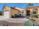 Inviting single-story home with a two-car garage and a cozy front patio at 5105 Kingsbridge Dr, Las Vegas, NV 89130
