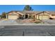 Two-unit home with attached garages and shared driveway at 5105 Kingsbridge Dr, Las Vegas, NV 89130